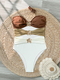 As shown in the picture Cutout One-Piece Bikini Swimsuit Color-Block Strapless Metal Flower